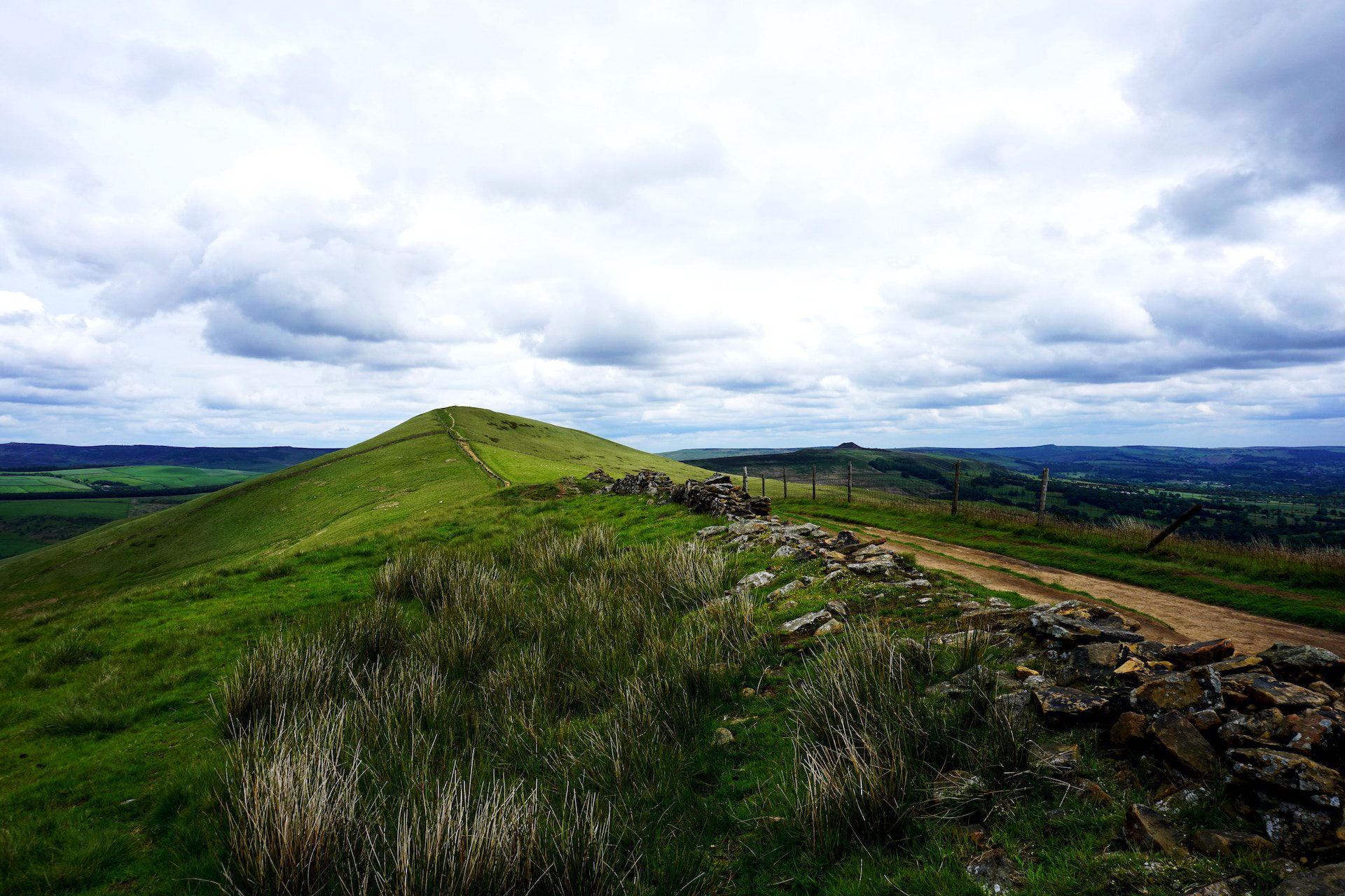 grass with hills and sky in background