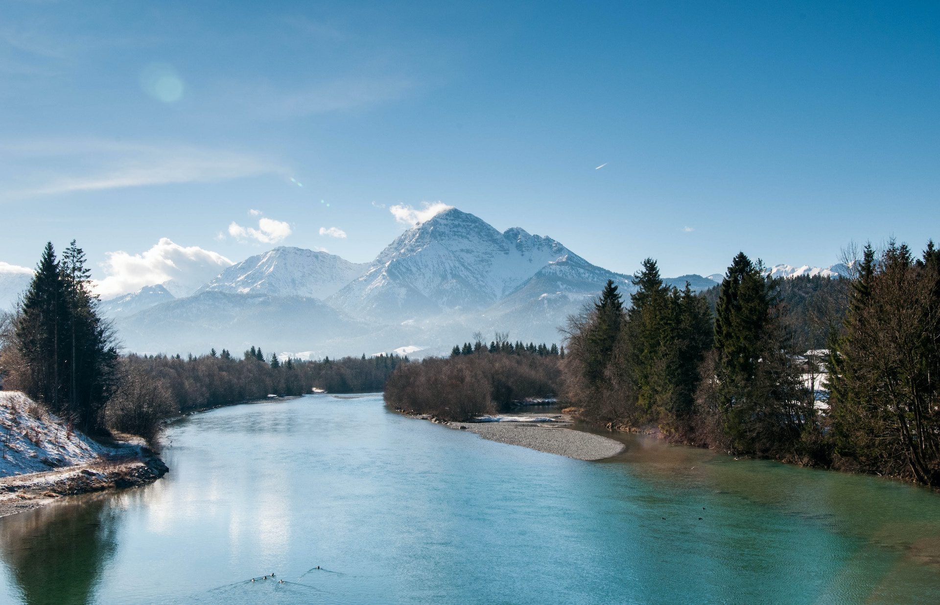 lake with trees and mountain in the background
