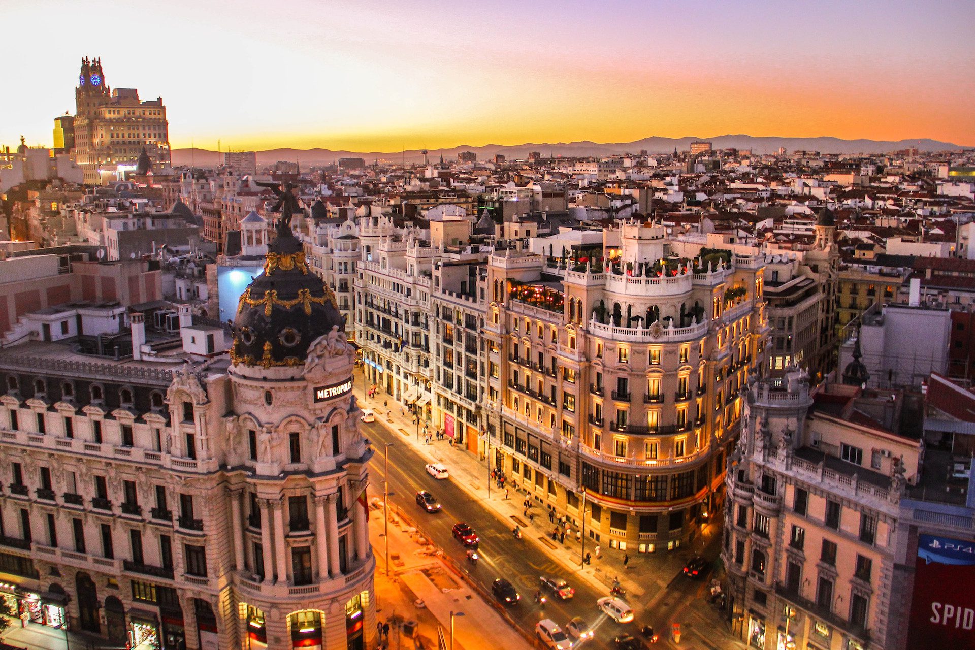 city of Madrid with buildings and a sunset