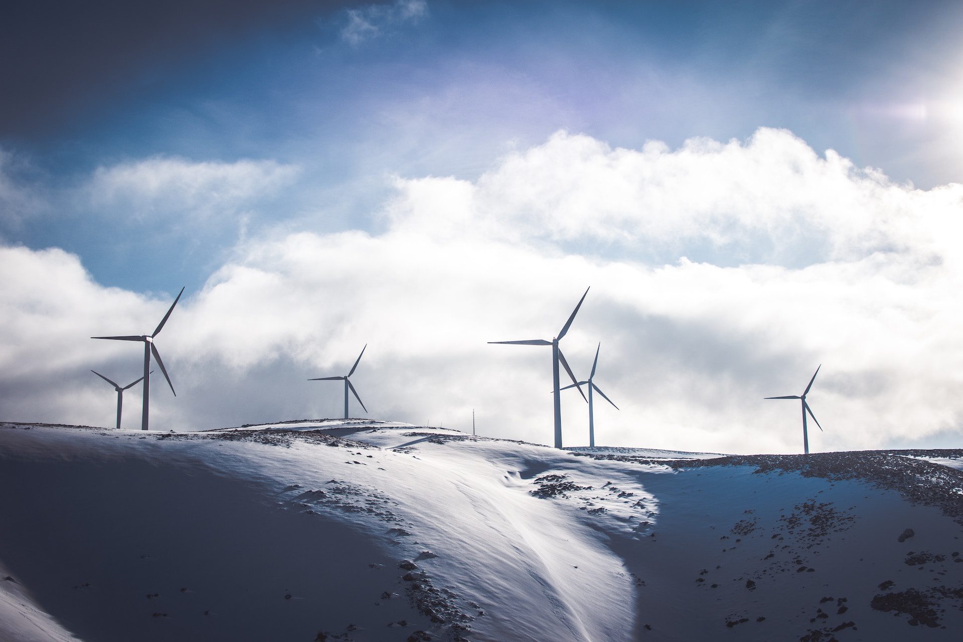 wind turbines with clouds in the background