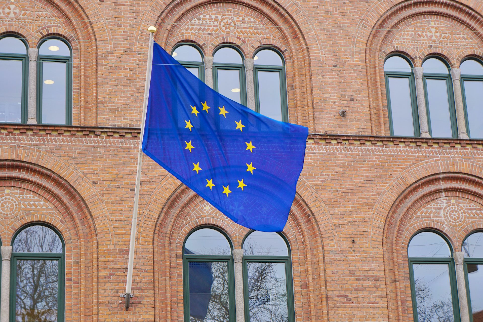 European flag attached to front of a building